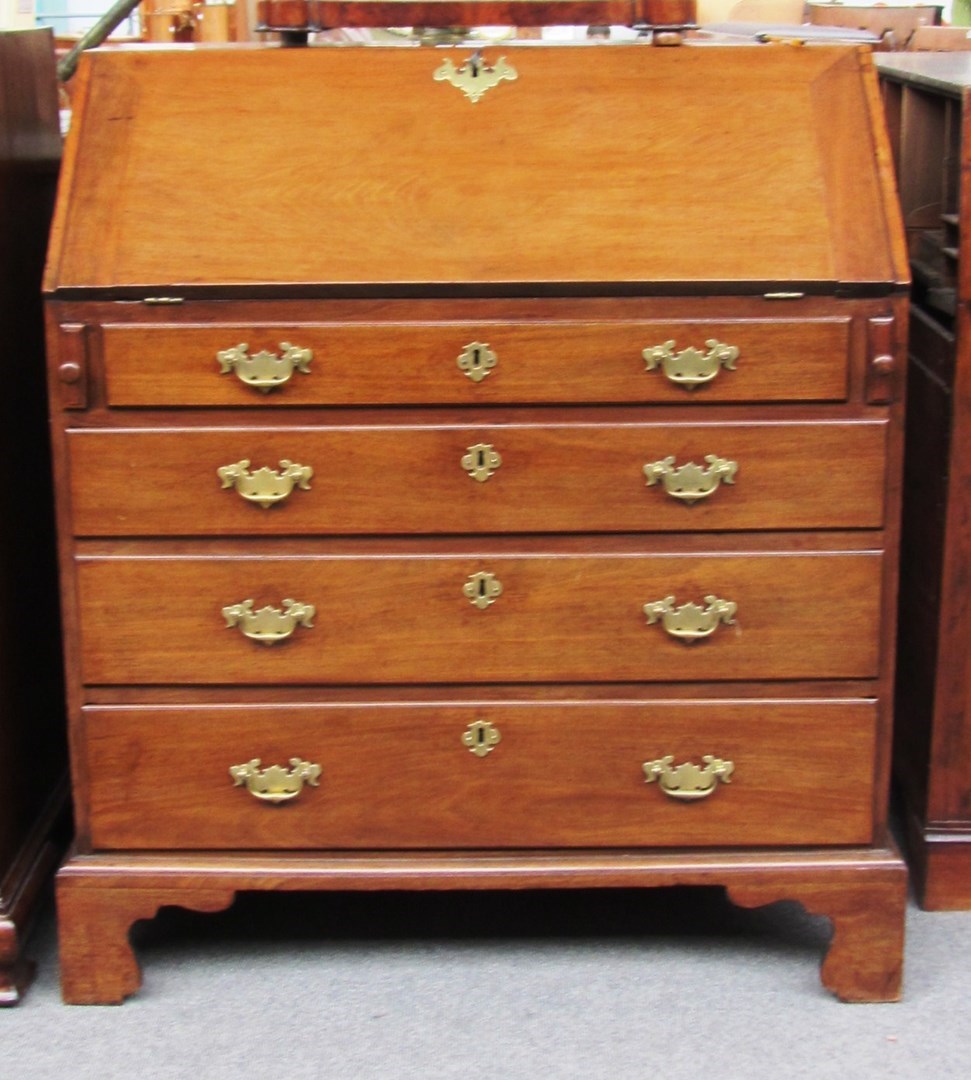 Appraisal: A George III mahogany bureau the fitted interior over four