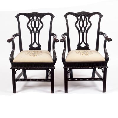 Appraisal: A pair of Chippendale style open armchairs with carved cresting