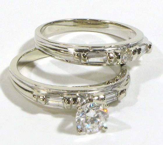 Appraisal: DIAMOND AND FOURTEEN KARAT WHITE GOLD WEDDING SET The engagement