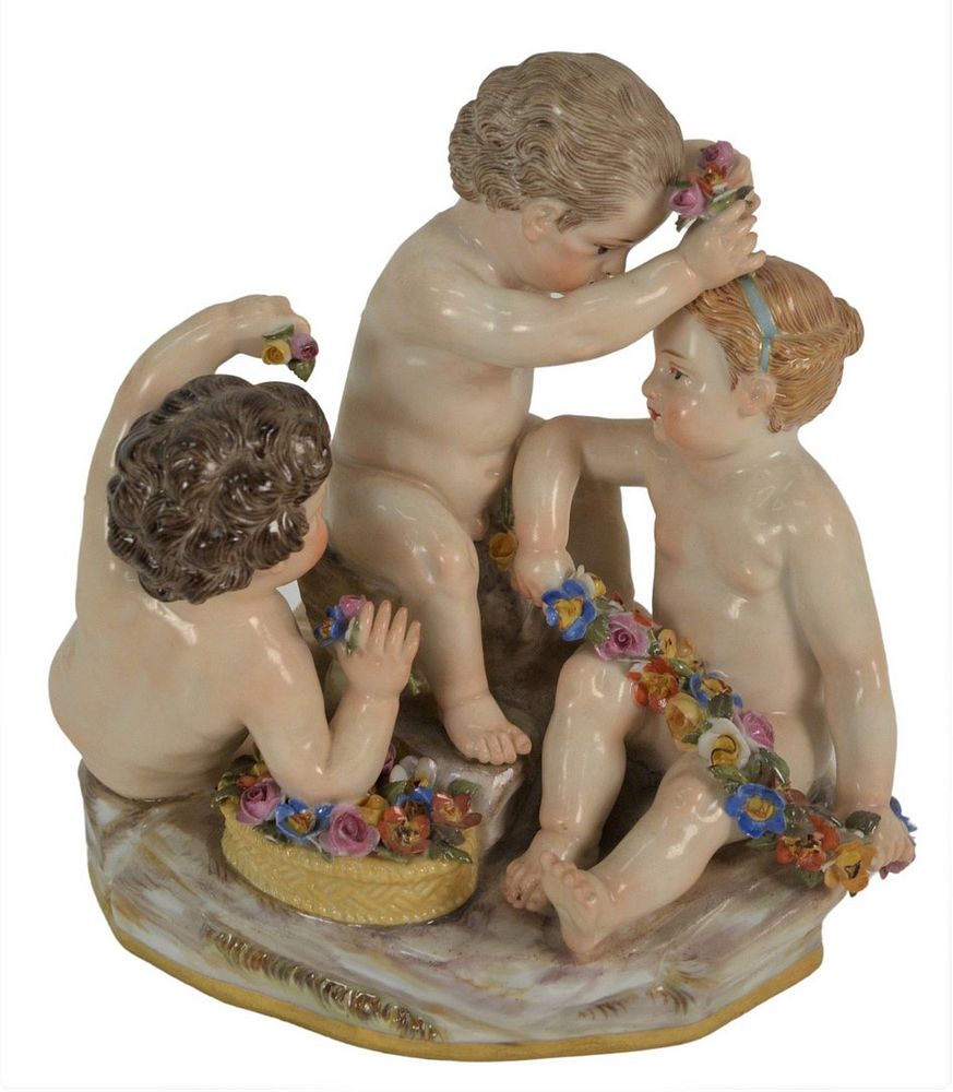 Appraisal: Meissen Figural Group having three puttis with flowers minor losses