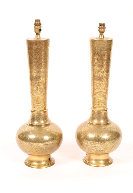 Appraisal: A PAIR OF MIDDLE EASTERN BRASS TABLE LAMPS of baluster