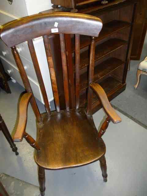 Appraisal: AN EARLY TH CENTURY LATH BACK WINDSOR ARMCHAIR