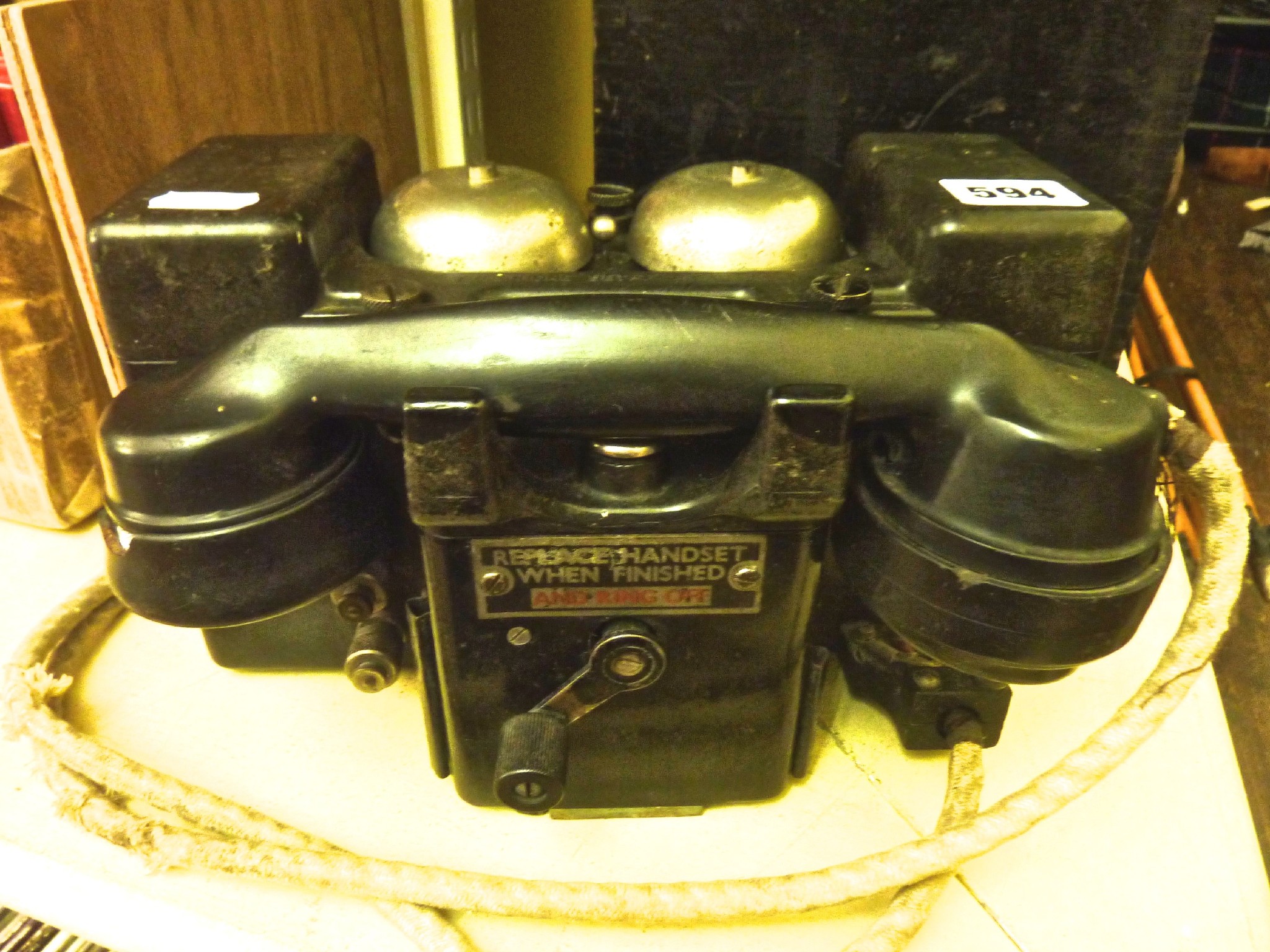 Appraisal: A black bakelite cased field telephone stamped 'Telephone set F