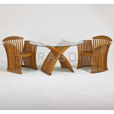 Appraisal: GARDEN Dining table and two chairs s Sculpted teak glass