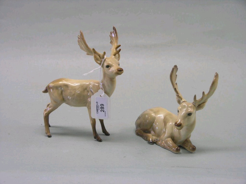 Appraisal: Two Beswick Stags Stag Lying Stag Standing light brown gloss