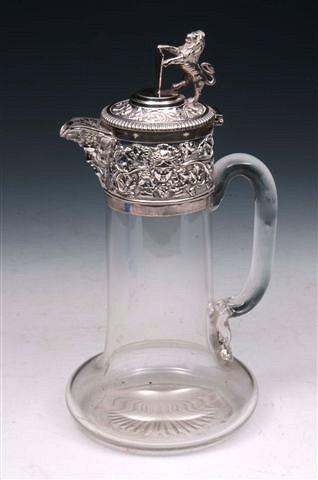 Appraisal: A GLASS CLARET JUG with silver plated mount depicting Bacchus