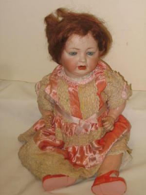 Appraisal: A Kestner bisque head character girl doll with blue glass