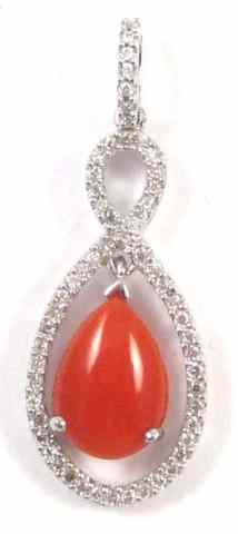 Appraisal: CORAL DIAMOND AND FOURTEEN KARAT GOLD PENDANT round-cut diamonds are