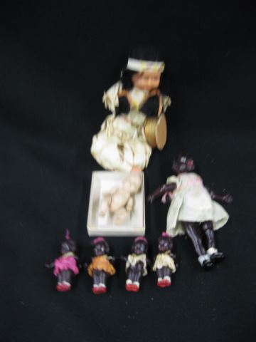 Appraisal: Dolls black celluloid to sizes seated Indian and a baby