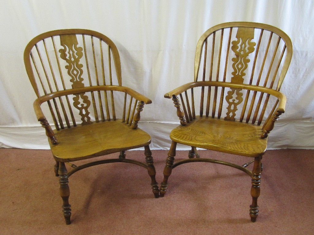 Appraisal: Two s elm Windsor armchairs raised on spindle supports cm