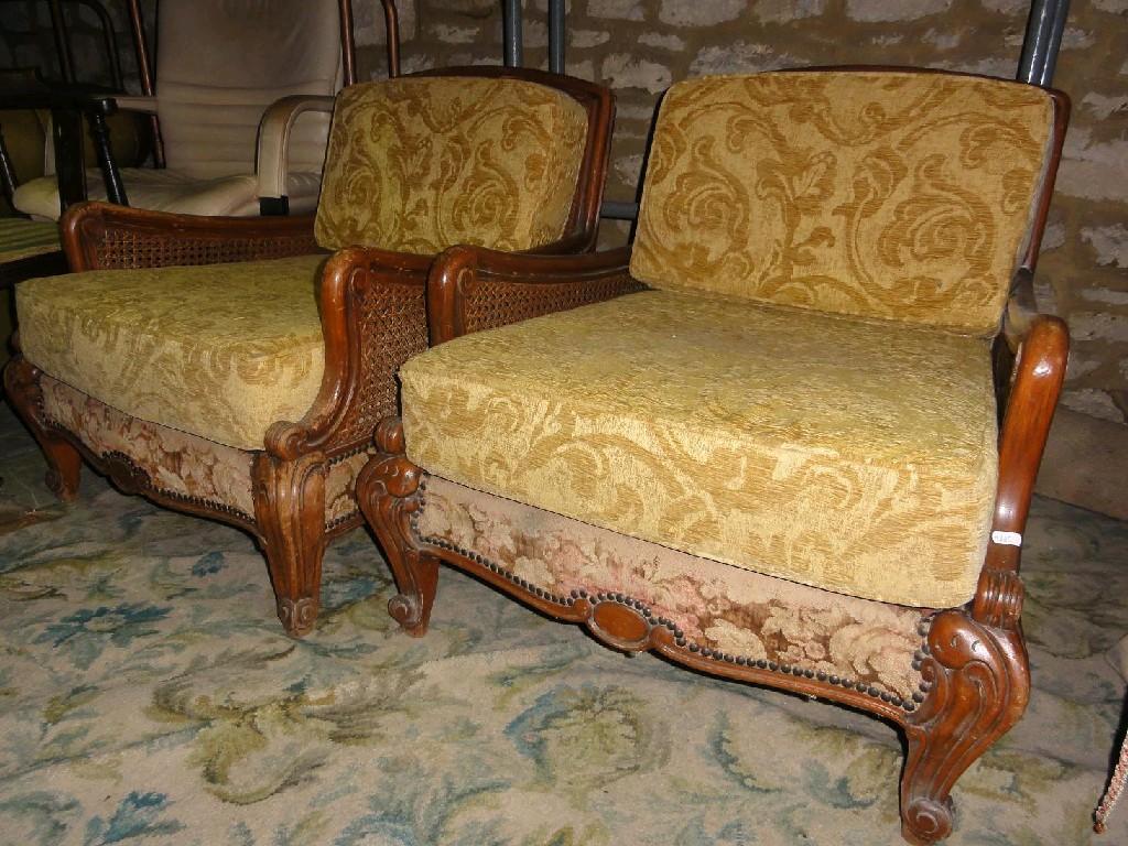 Appraisal: A pair of continental armchairs with cane panelled backs and