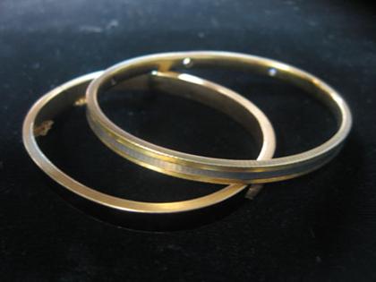 Appraisal: Two karat yellow gold bangle bracelets One black enamel bangle