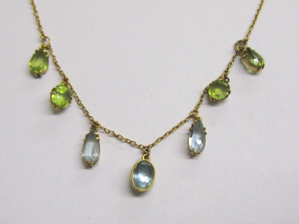 Appraisal: Nine carat gold peridot and aquamarine set necklace