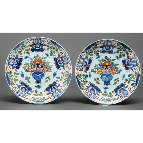 Appraisal: A pair of English Delftware plates possibly Bristol c painted