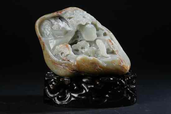 Appraisal: CHINESE CELADON AND RUSSET JADE BOULDER Carved to depict figures