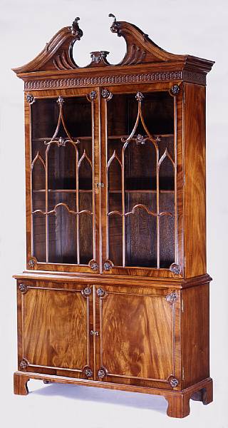 Appraisal: A George III style mahogany bookcase cabinet The swan's neck