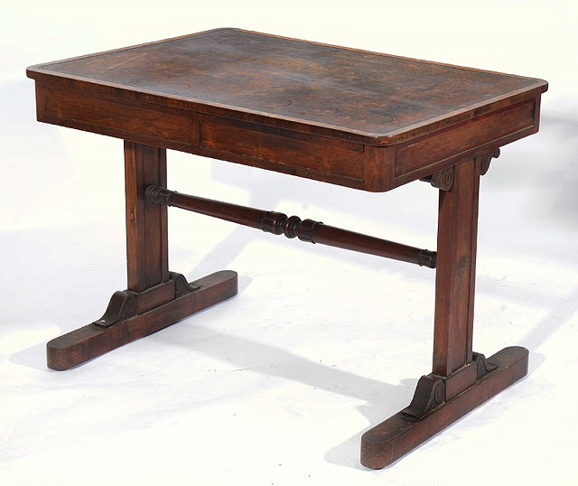 Appraisal: AN EARLY VICTORIAN ROSEWOOD RECTANGULAR WRITING TABLE fitted two frieze