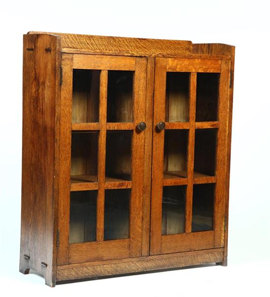 Appraisal: ARTS CRAFTS BOOKCASE American early th century quarter sawn oak