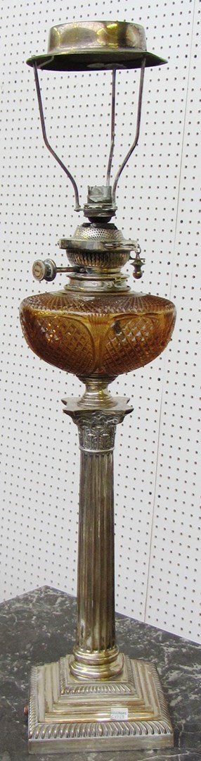 Appraisal: A silver and silver plated oil lamp converted to a