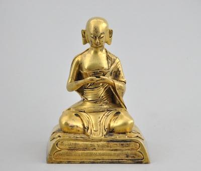 Appraisal: A Gilt Bronze Figurine of a Seated Luohan Serenely seated