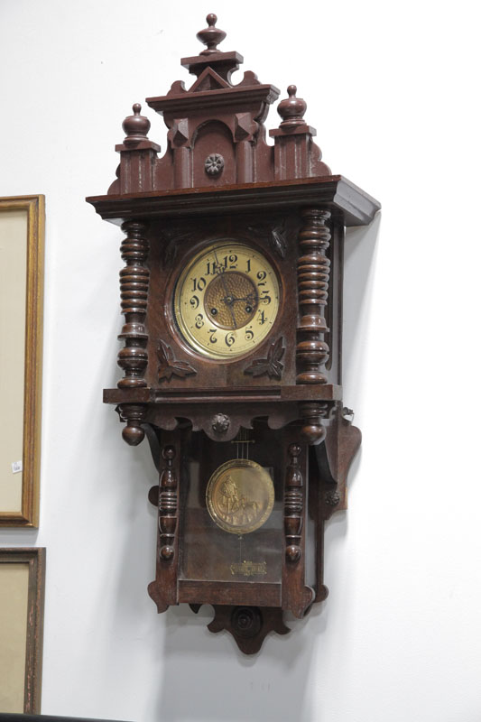 Appraisal: GERMAN WALL CLOCK Eight day time strike with brass works