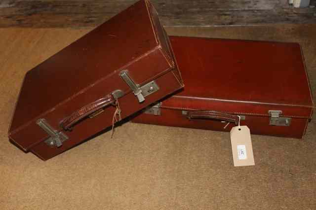 Appraisal: TWO BROWN LEATHER SUITCASES together with a smaller leather travelling