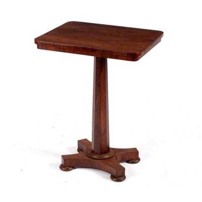 Appraisal: A Victorian rosewood table on an octagonal tapered column and