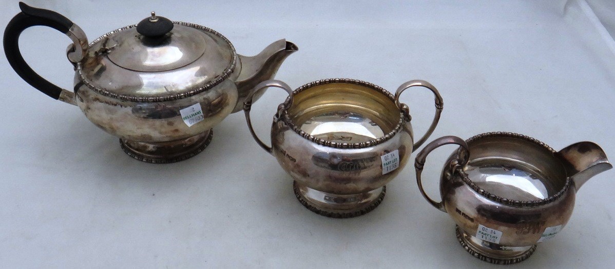 Appraisal: A silver three piece composite tea set comprising a teapot