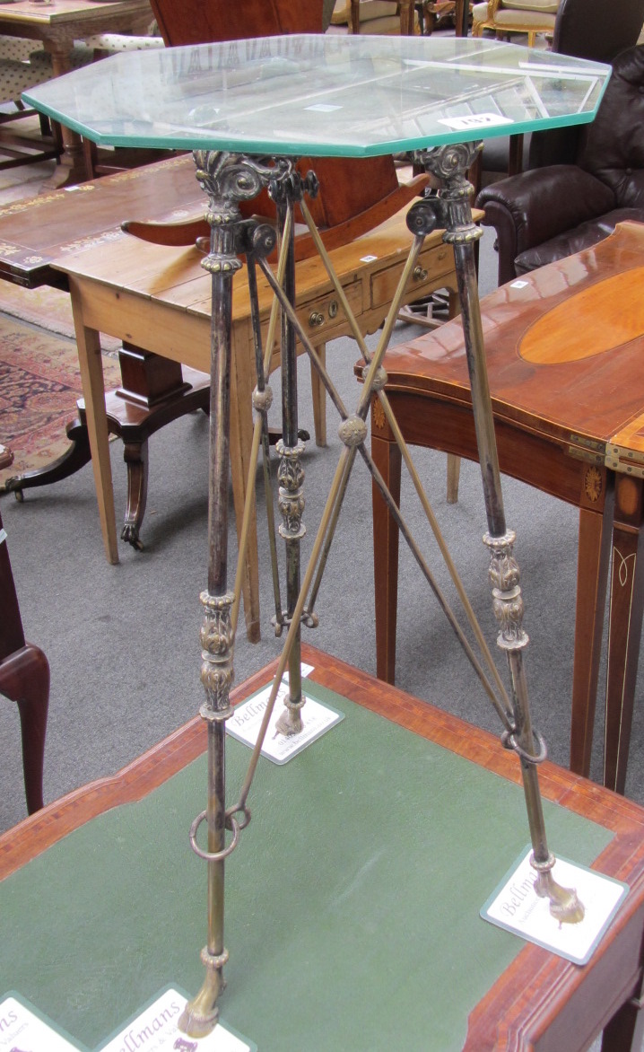 Appraisal: A pair of brass jardiniere stands each with octagonal glass