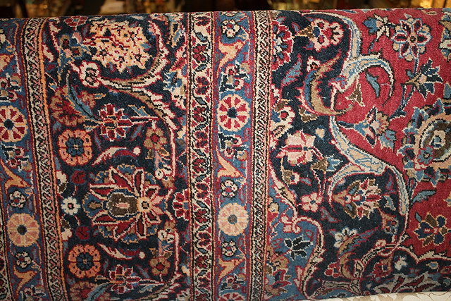 Appraisal: A MAHAL RED GROUND CARPET with central blue medallion allover