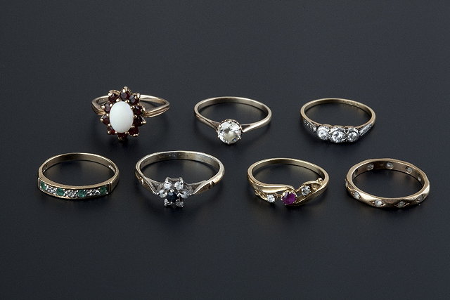 Appraisal: A collection of gem set rings comprising a diamond three