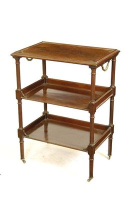 Appraisal: A French mahogany three tier etagere by Eugene Dienst with