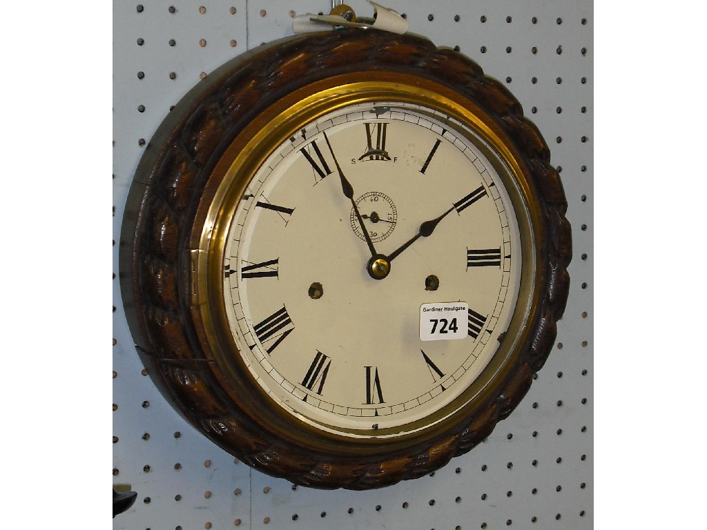 Appraisal: Oak two train ship's wall clock the cream dial with