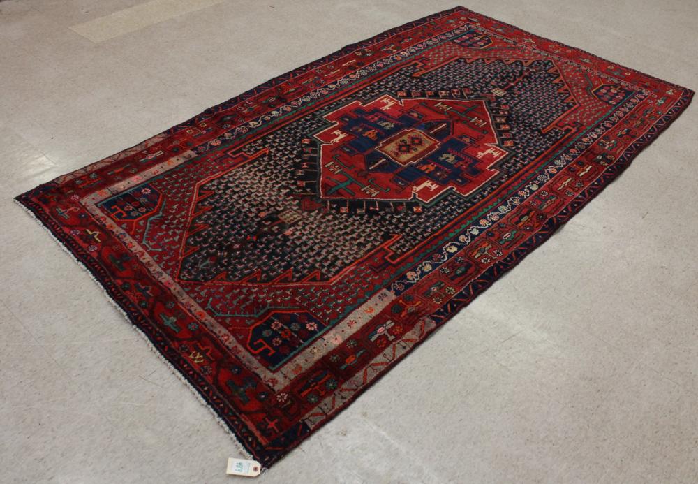 Appraisal: HAND KNOTTED PERSIAN CARPET central geometric medallion design ' x