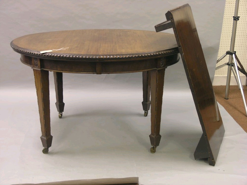 Appraisal: A George V mahogany dining table with extra leaf oval