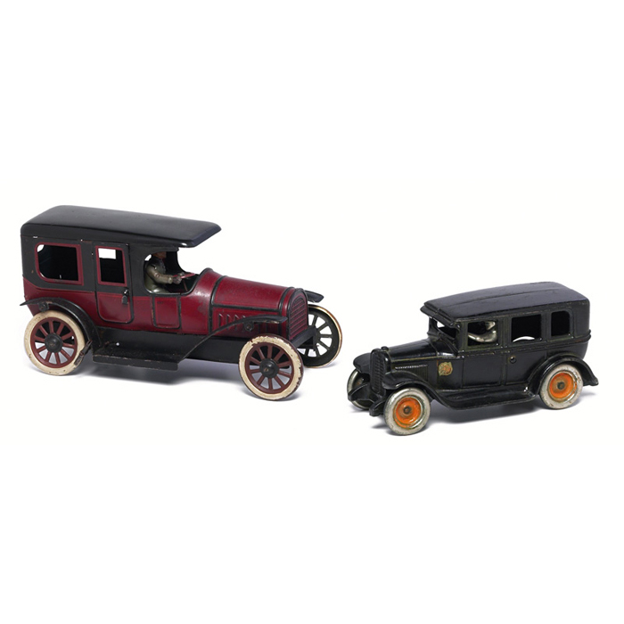 Appraisal: Americana toys two motorcars with drivers molded metal good finish