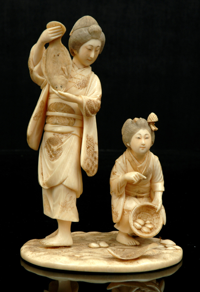 Appraisal: A JAPANESE CARVED IVORY OKIMONO Meiji Period - The figure