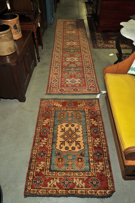 Appraisal: TWO ORIENTAL STYLE AREA RUGS A mat with salmon ground