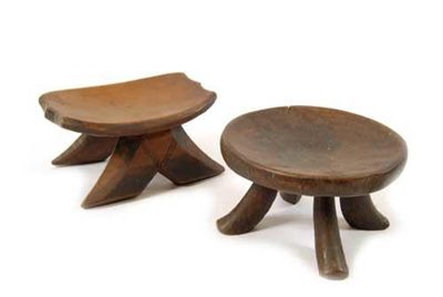 Appraisal: An African oval seated stool raised on four scroll legs