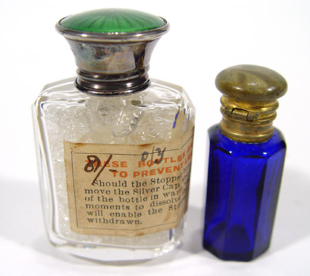 Appraisal: Cut glass and silver topped scent bottle with green enamelled