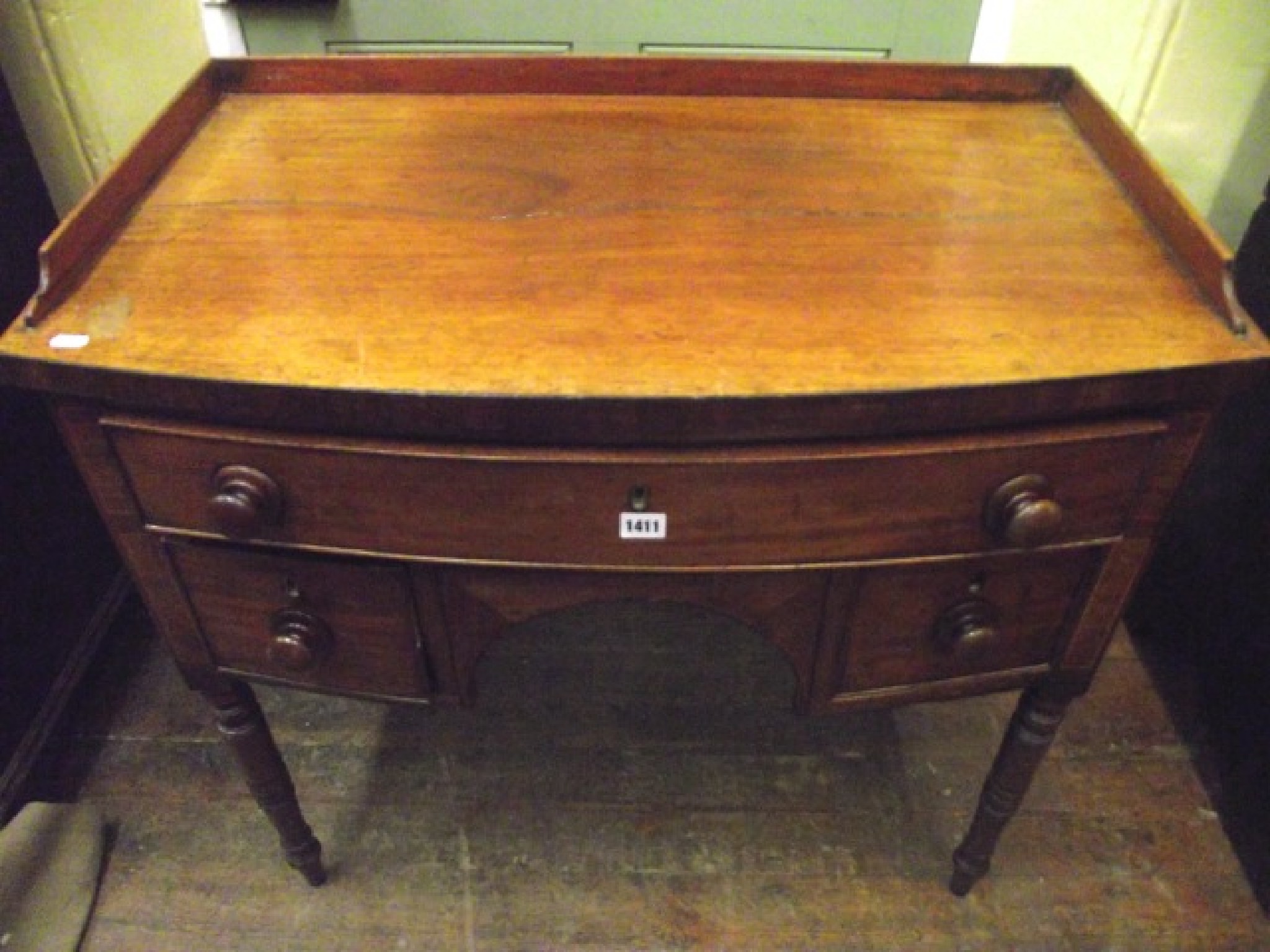 Appraisal: A small Regency mahogany sideboard fitted with one long and