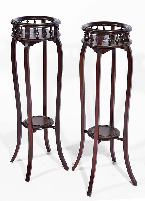 Appraisal: Pair of ebonised jardiniere standsEdwardian with spindle circular tops cm