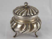 Appraisal: A Continental grade silver covered sugar bowl on three feet