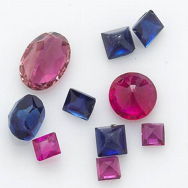 Appraisal: A collection of unmounted rubies sapphires and tourmaline total gem