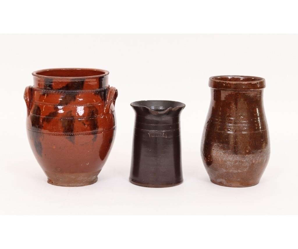 Appraisal: Redware ovoid crock with applied ear handles and black splash