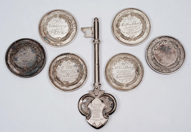 Appraisal: A silver commemorative keyof stylised form grams together with a