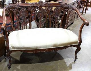 Appraisal: English settee th century having a pierced and carved back