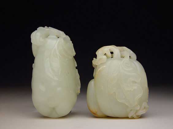 Appraisal: TWO ANTIQUE JADE TOGGLES Two antique Chinese carved whitish light-green