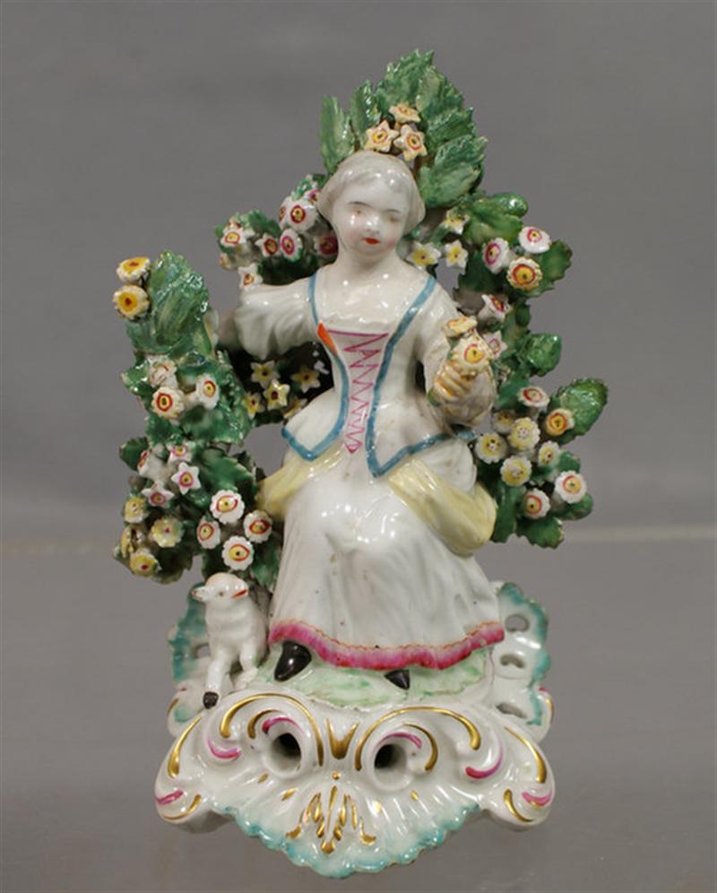 Appraisal: English porcelain bocage figurine of a seated woman holding flowers