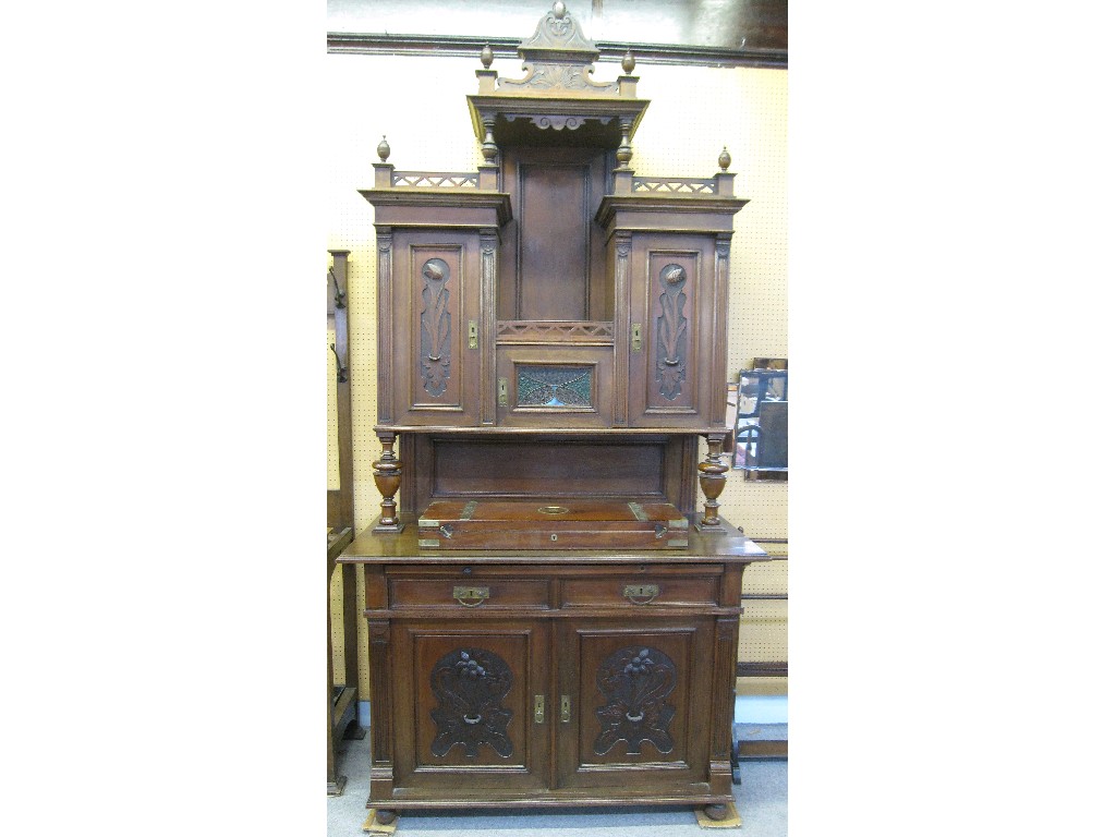 Appraisal: Continental Art Nouveau carved walnut cabinet with central stained glass